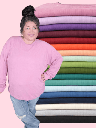 a plus size woman  in a brushed ribbed pullover with high stretch and a comfortable fit, available in lots of colors, perfect for curvy moms with apple or pear shape bodies