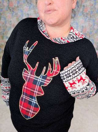 Reindeer Patch Hooded Top in Black-2- Long Sleeve Tops-HEIMISH-Styled by Stacked - A Plus Size Women's Boutique in Lakeville, MN